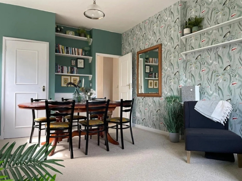 Photo of a teal coloured, vintage style dining room 